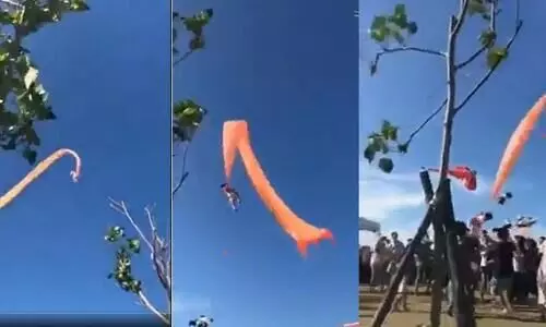 കൂറ്റൻ പട്ടത്തി​െൻറ വാലിൽ കുടുങ്ങി കാറ്റിലാടിയുലഞ്ഞ്​ മൂന്നുവയസ്സുകാരി; ശ്വാസമടക്കിപ്പിടിച്ച്​ നാട്ടുകാർ