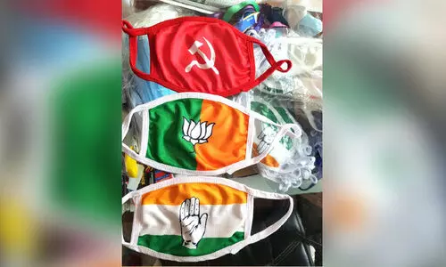 മാസ്​ക്കിലും രാഷ്​ട്രീയം; ഫ്ലക്​സ്​ കടകളിലും പ്രസുകളിലും തിരക്കൊഴിയുന്നില്ല