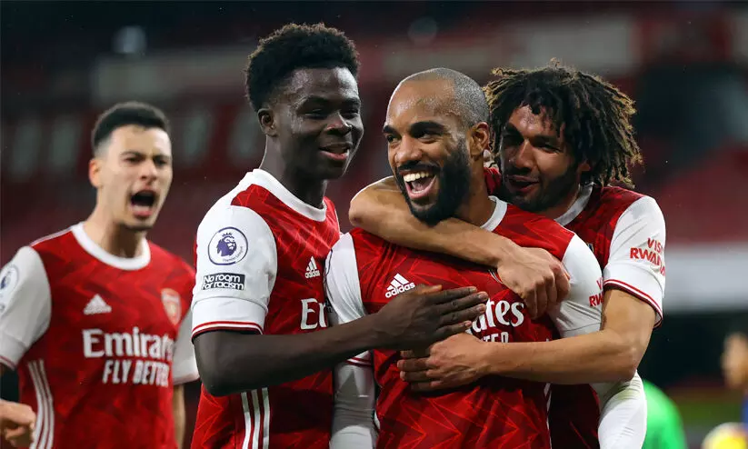 arsenal players celebrates goal