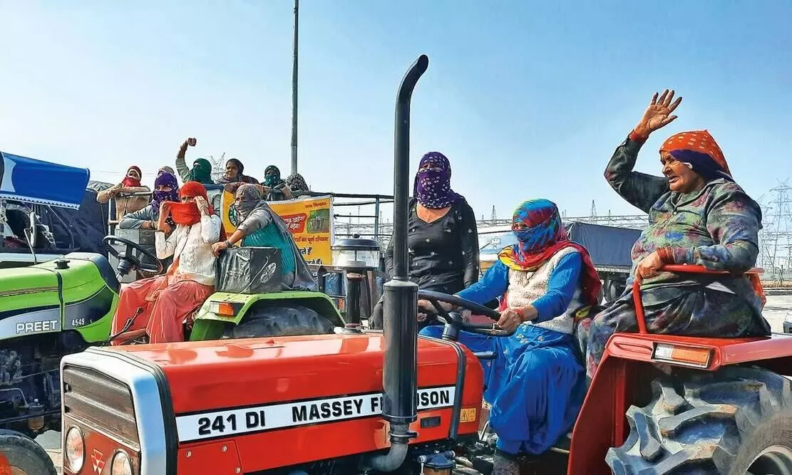 women in tractor