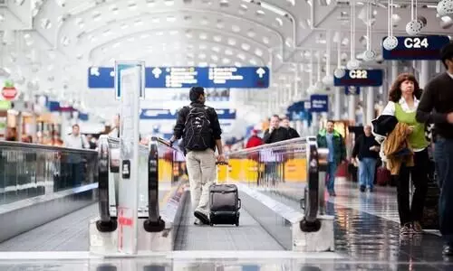 Indian-American held for living