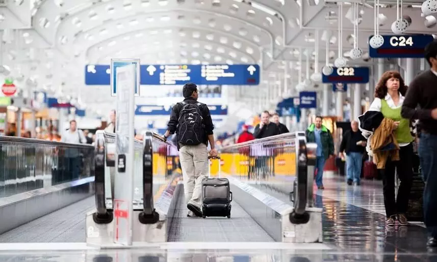 Indian-American held for living