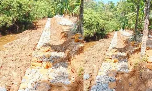 ഭൂമി കൈയേറി സർക്കാർ ചെലവിൽ ഭിത്തി നിർമാണം