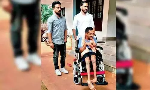 Farmer Award winner Arun Kumar gets an electronic wheel chair