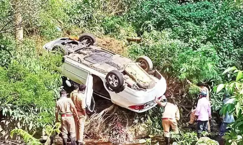 Tourists escape from car overturned in Munnar
