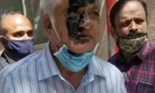 Writer K S Bhagavans face smeared with black ink by advocate at Bengaluru court