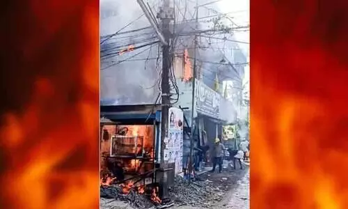 Fire from gas stove, shop burns down