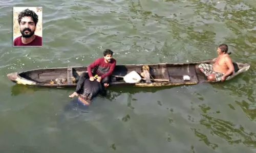 കായലിൽ വീണ യുവാവിനെ ബൈക്ക് യാത്രികൻ രക്ഷപ്പെടുത്തി