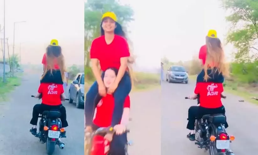 insta video goes viral Bike stunt costs two women Rs 28,000 fine