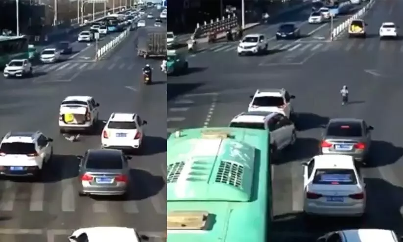 Toddler falls from moving car on busy road in viral video