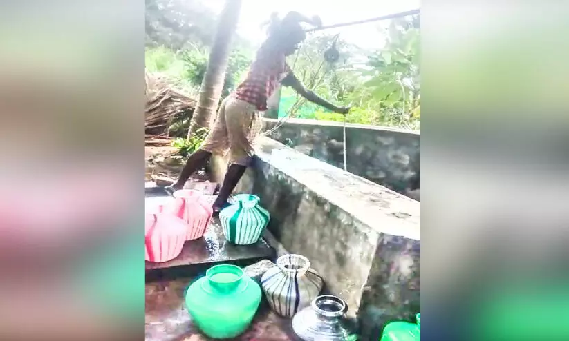 boy collecting water