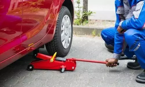 car lifting through hydraulic jack