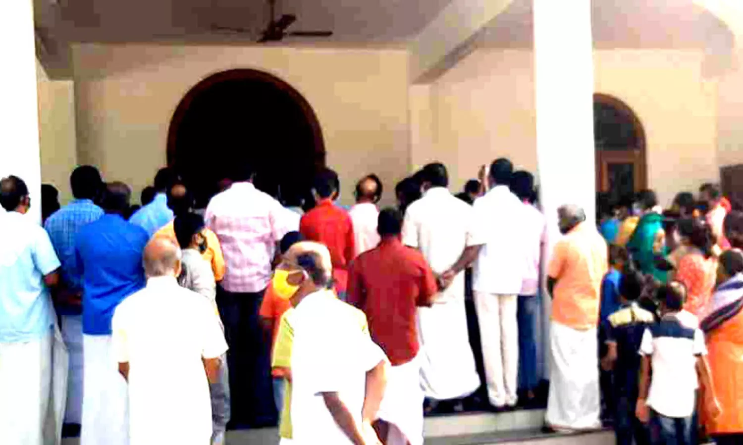 believers gathered in front of church