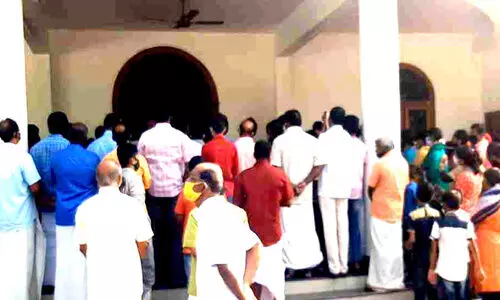believers gathered in front of church