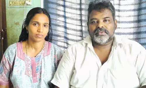 saji and his wife Reena