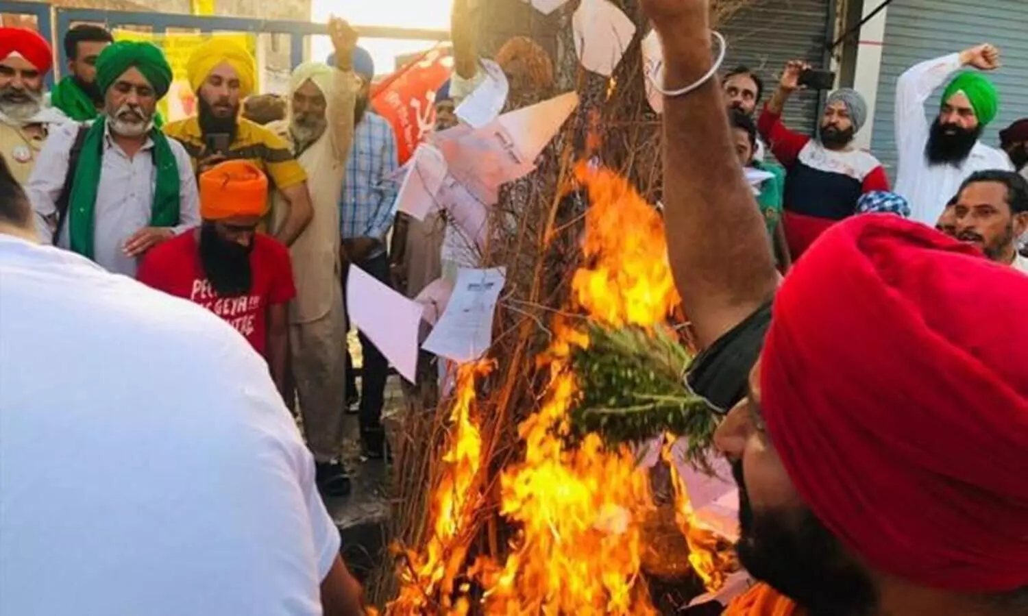 Farmers celebrate Holika Dahan by burning copies of Centres farm laws