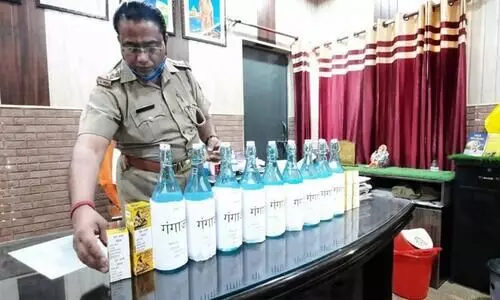 UP cop purifies visitors at police station with gangajal Chants sanitisation mantra