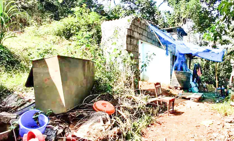 collapsed home of flood victim