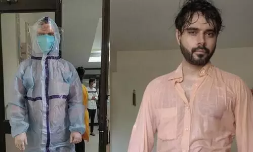 Doctor shows what being in PPE suit