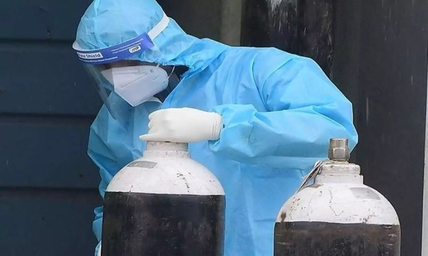 Health Worker With Oxygen Cylinder