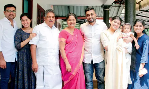 saji cherian and family