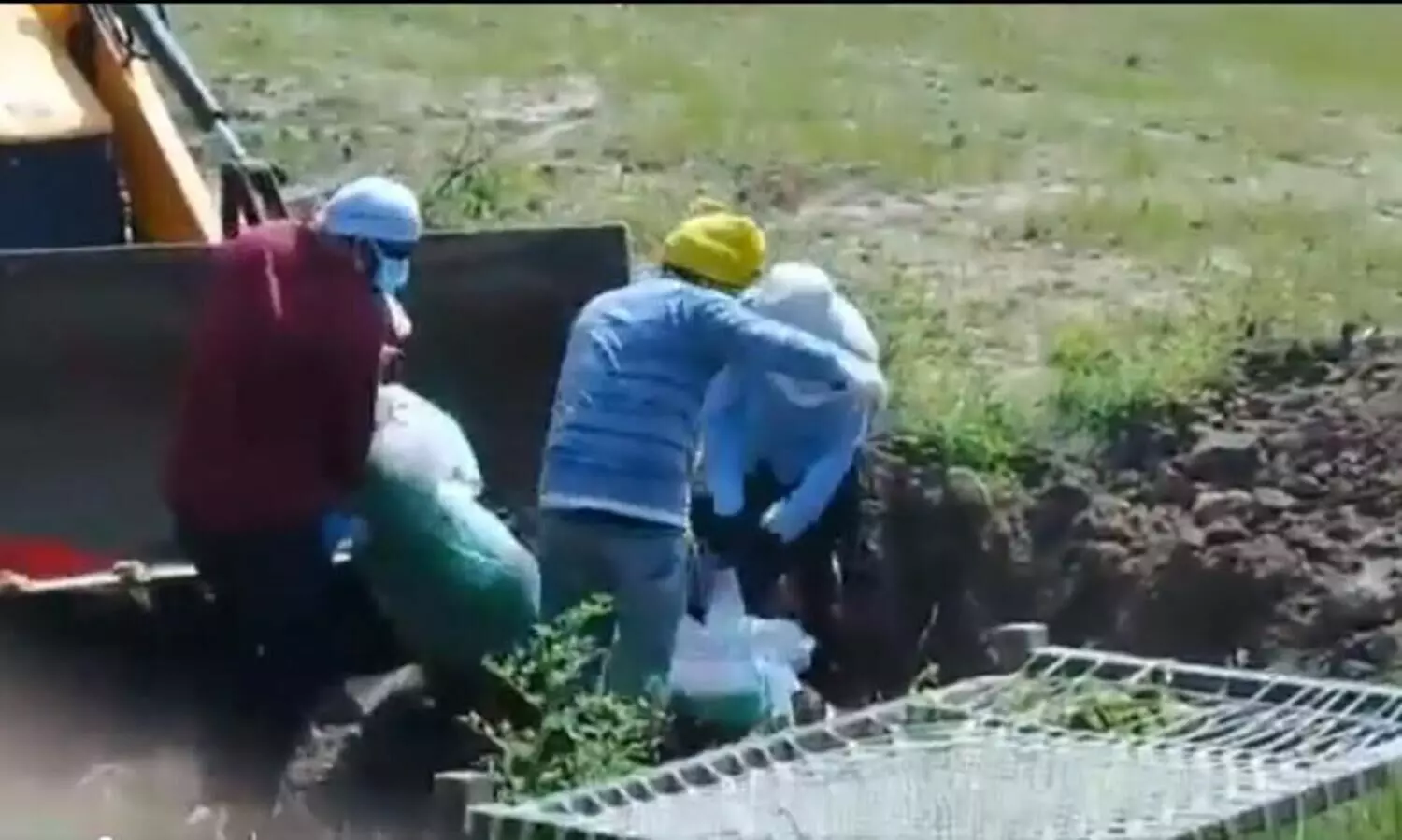 three men using JCB to bury covid 19 fathers body in UP surfaces viral video