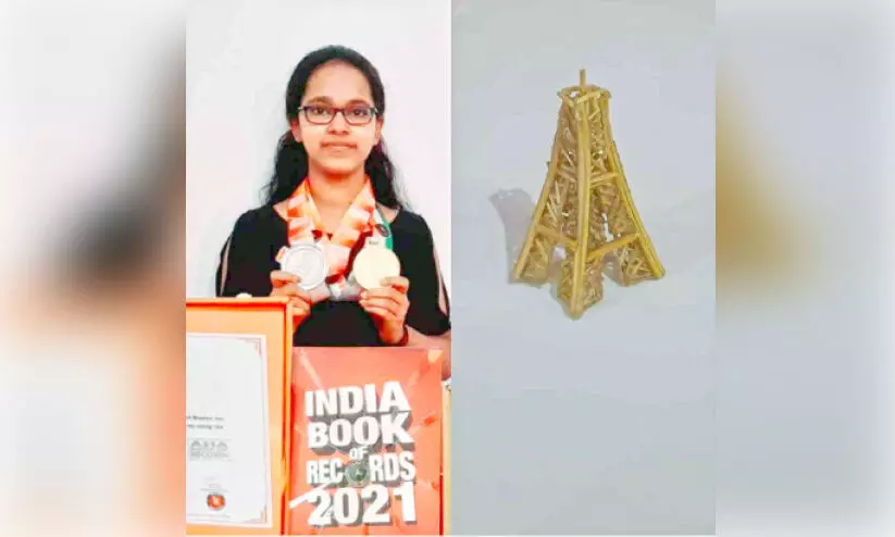 devika with eiffel tower miniature devika with eiffel tower miniature