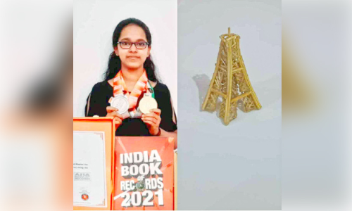 devika with eiffel tower miniature