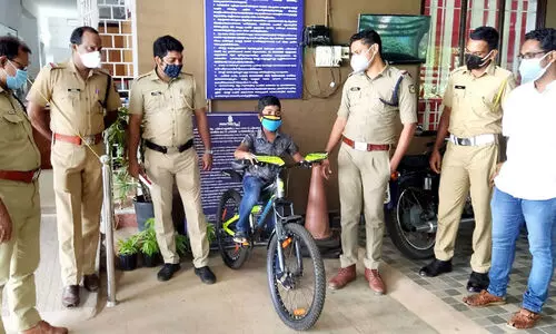 police gives bicycle to child