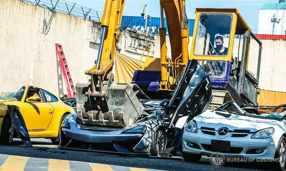 Luxury cars worth $1.2 million crushed to pieces in
