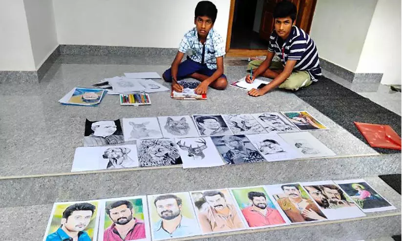 brothers with their drawings