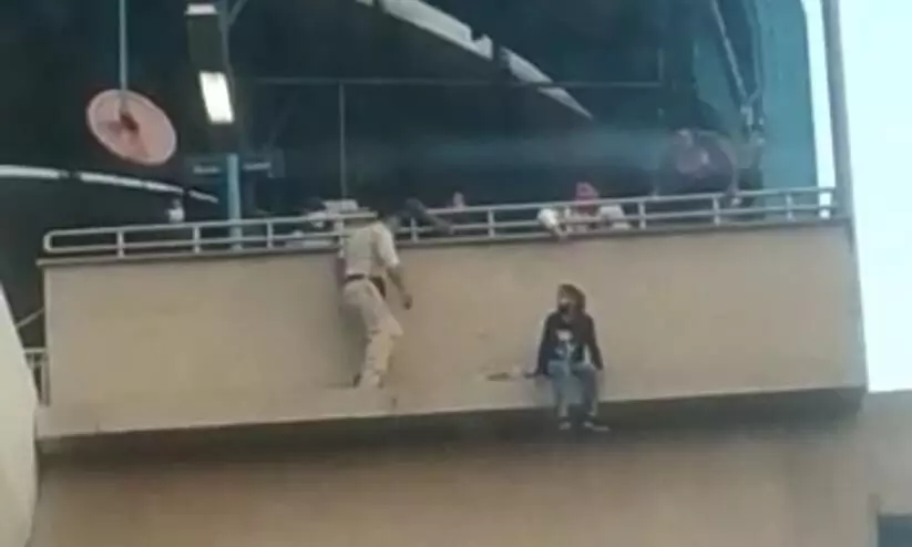 Faridabad cops save woman from jumping off metro station Video Viral