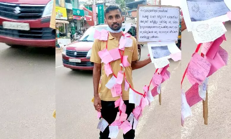പിഴയടച്ച രസീതുകൾ മാലയാക്കി ഒറ്റയാൾ പ്രതിഷേധം