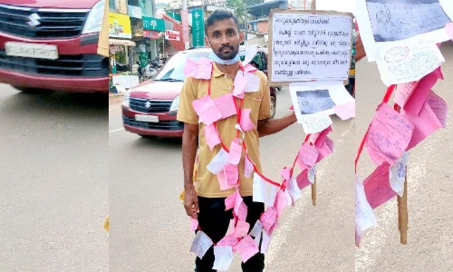 പിഴയടച്ച രസീതുകൾ മാലയാക്കി ഒറ്റയാൾ പ്രതിഷേധം