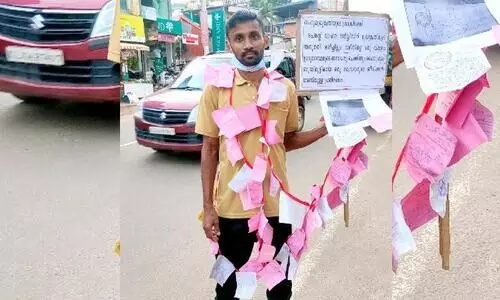 പിഴയടച്ച രസീതുകൾ മാലയാക്കി ഒറ്റയാൾ പ്രതിഷേധം