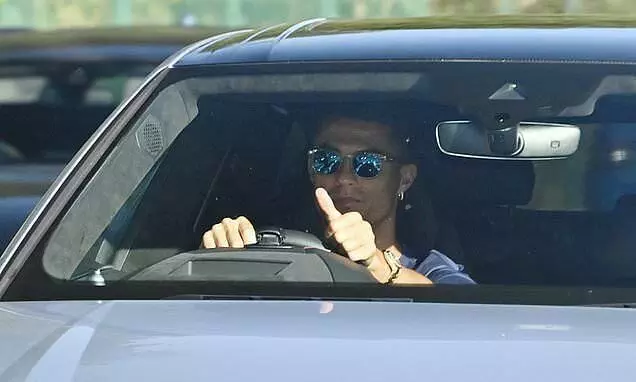 Cristiano Ronaldo arrives for Manchester United training in a