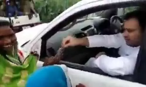 Video of Tejashwi Yadav distributing cash among women inviting backlash for the Opposition leader