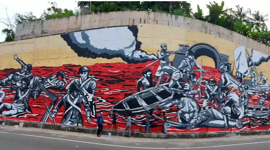 ക​ലാ​പം അ​ഞ്ചു​തെ​ങ്ങി​ലോ ആ​റ്റി​ങ്ങ​ലി​ലോ?  ചു​മ​ർ​ചി​ത്ര​ത്തിൻെറ പേ​രി​ൽ വി​വാ​ദം കൊ​ഴു​ക്കു​ന്നു