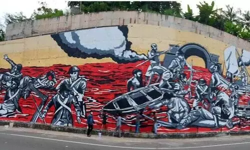 ക​ലാ​പം അ​ഞ്ചു​തെ​ങ്ങി​ലോ ആ​റ്റി​ങ്ങ​ലി​ലോ?  ചു​മ​ർ​ചി​ത്ര​ത്തിൻെറ പേ​രി​ൽ വി​വാ​ദം കൊ​ഴു​ക്കു​ന്നു