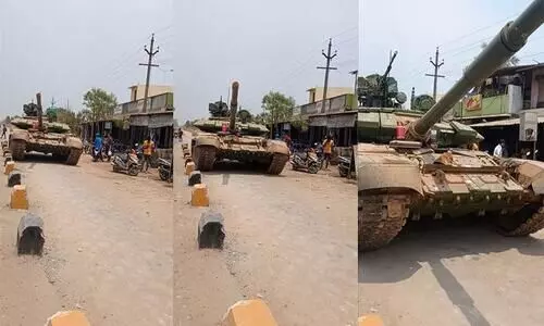 An Army battle tank driving on an Indian Road Video