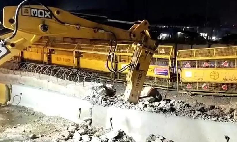 Delhi Police starts removing barricades along Tikri border Delhi Police starts removing barricades along Tikri border