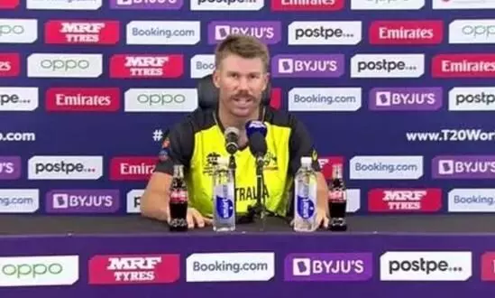 T20 World Cup: Warner removes Coca-Cola bottles during press conference - VIDEO
