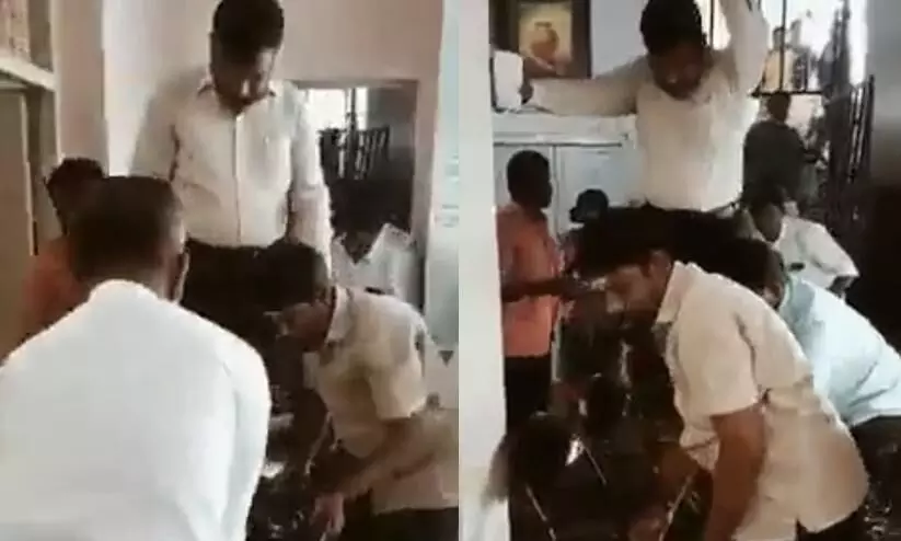 VCK leader walks on chairs to reach car in Chennai