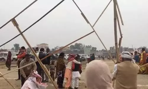 Hoardings of BJP Rally Uprooted for Firewood