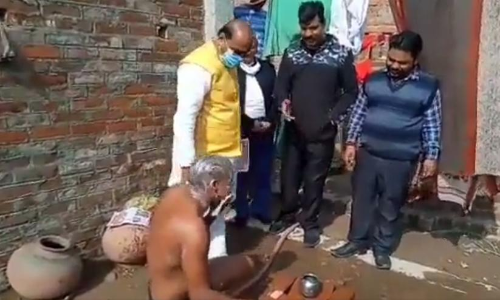 Campaigning BJP MLA Asks Man Bathing Do You Have Ration Card Campaigning BJP MLA Asks Man Bathing Do You Have Ration Card