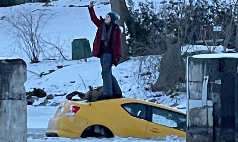 Woman Takes Selfie On Top Of Sinking Car Woman Takes Selfie On Top Of Sinking Car