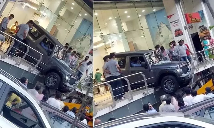 Mahindra Thar delivery gone wrong: Customer drives it through showroom’s glass wall Mahindra Thar delivery gone wrong: Customer drives it through showroom’s glass wall
