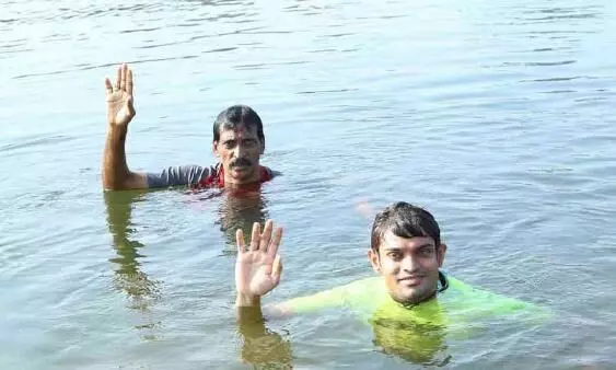 Shan swims into history