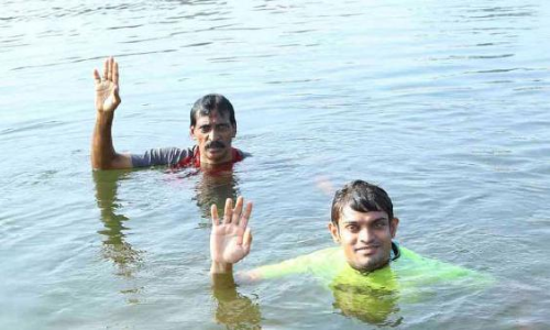 Shan swims into history