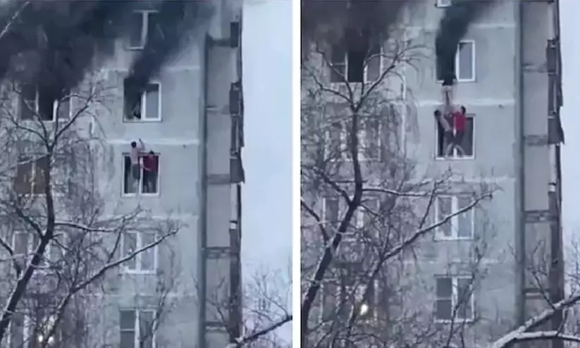 തീപടരുന്ന കെട്ടിടത്തിന്റെ ഒമ്പതാംനിലയിൽനിന്ന് യുവതിയെ അതിസാഹസികമായി രക്ഷിച്ച് യുവാക്കൾ -വിഡിയോ